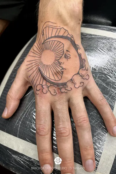 black-ink-tattoo-sun-moon-cloud-hand-men