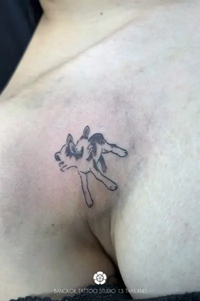 calf-2-head-tattoo-weird