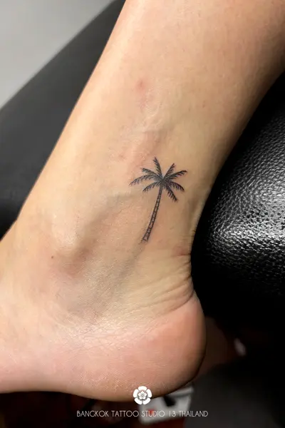 fine-line-tattoo-palm-tree-ankle