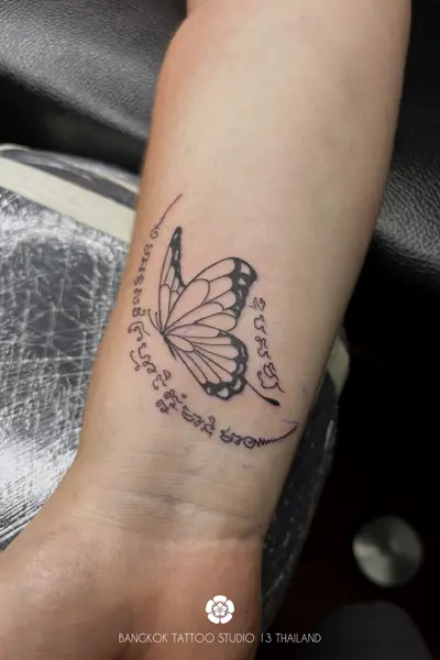 sak-yant-butterfly-tattoo-women